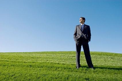 successful people standing on the grass stock photo