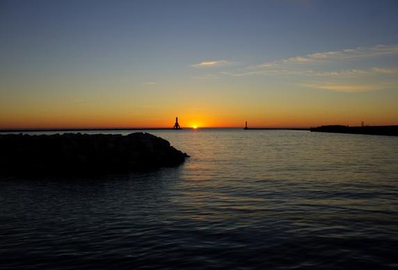sunrise between the lighthouses at port washington wisconsin