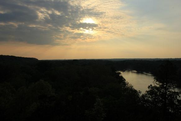 sunset behind clouds at starved rock state park illinois