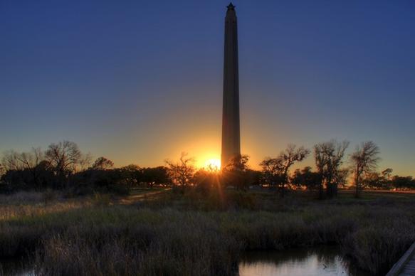 sunset behind monument at san jacinto monument texas