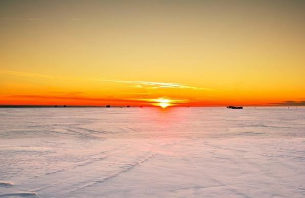 sunset on the icy lake at high cliff state park wisconsin