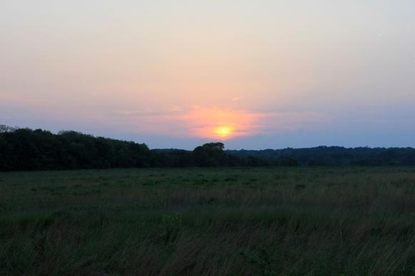 sunset over prarie at prophetstown state park indiana
