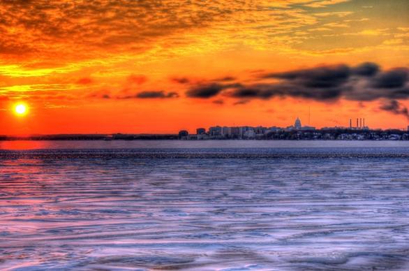 sunset over the ice with city in madison wisconsin