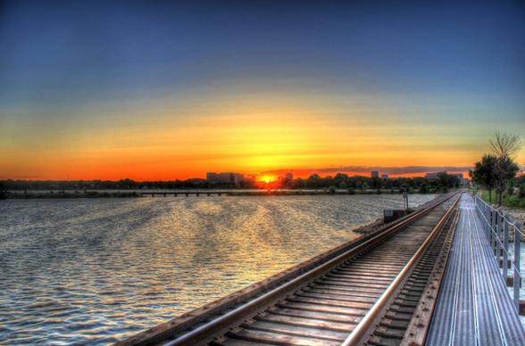 sunset over the train tracks by the lake in madison wisconsin