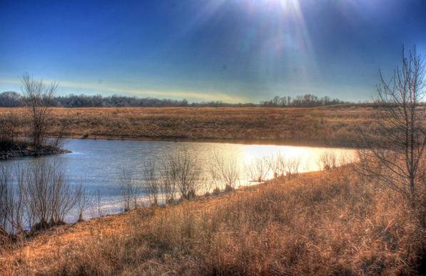 sunshine over the lake at weldon springs state natural area missouri