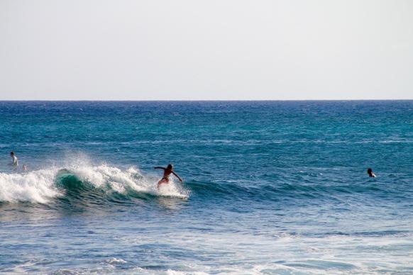 surfer boy riding wave
