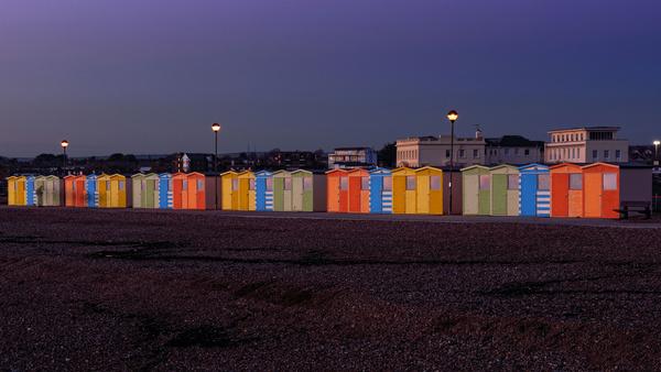 the beach huts seaford at dusk