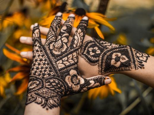 traditional mehndi art picture decorated hands closeup