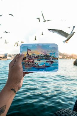 turkey scenery picture hand holding painting flying birds sea view