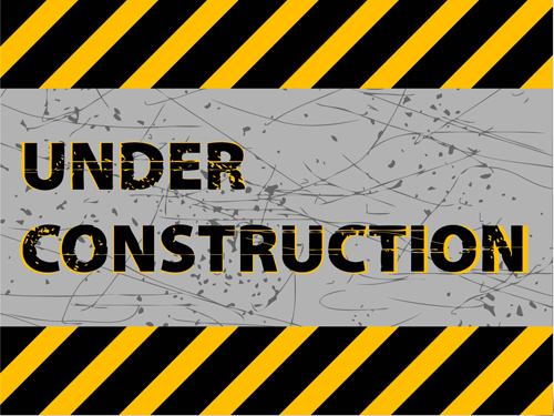under construction sign grunge background vector