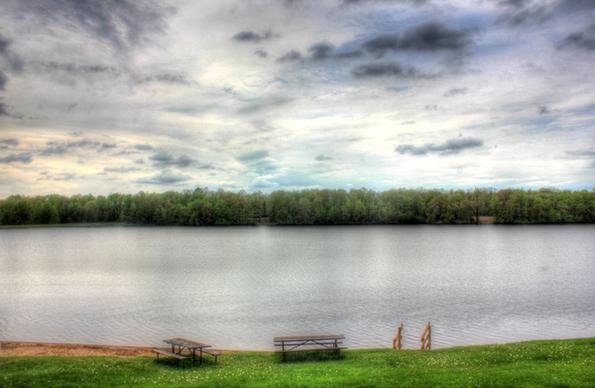 view across the lake with clouds at council grounds state park wisconsin