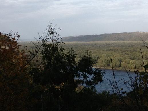 view of river behind trees at effigy mounds iowa