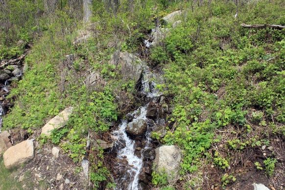 waterfall at the side of the road at the adirondack mountains new york