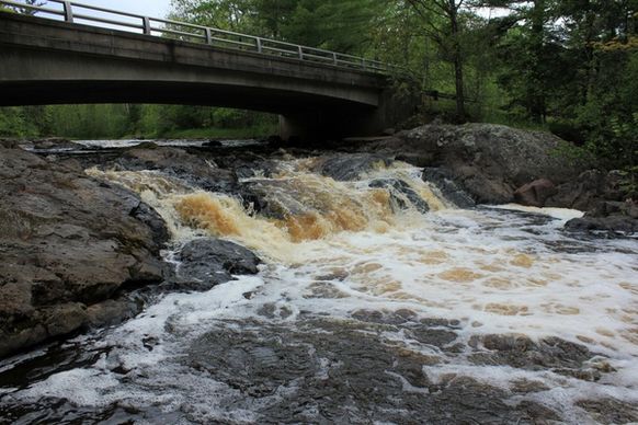 waterfalls under the bridge at amnicon falls state park wisconsin