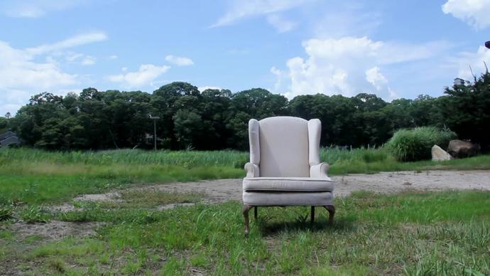 white armchair abandoned outdoor