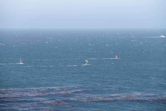 windsurfers on ocean