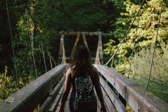 woman traveling a bridge