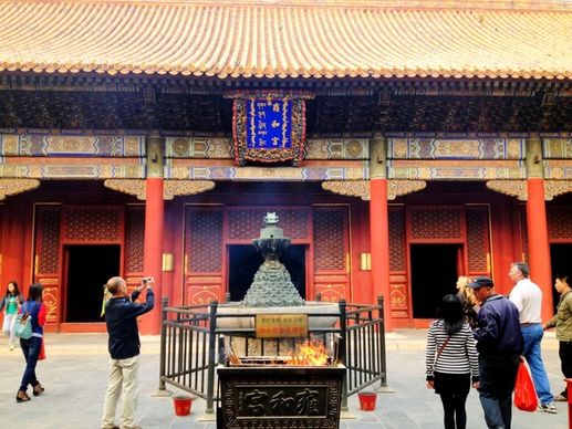 worshipping at lama temple in beijing china