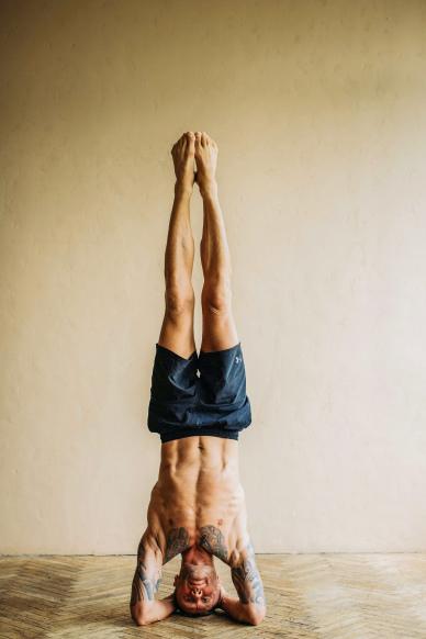 yoga lifestyle picture realistic man upside down 